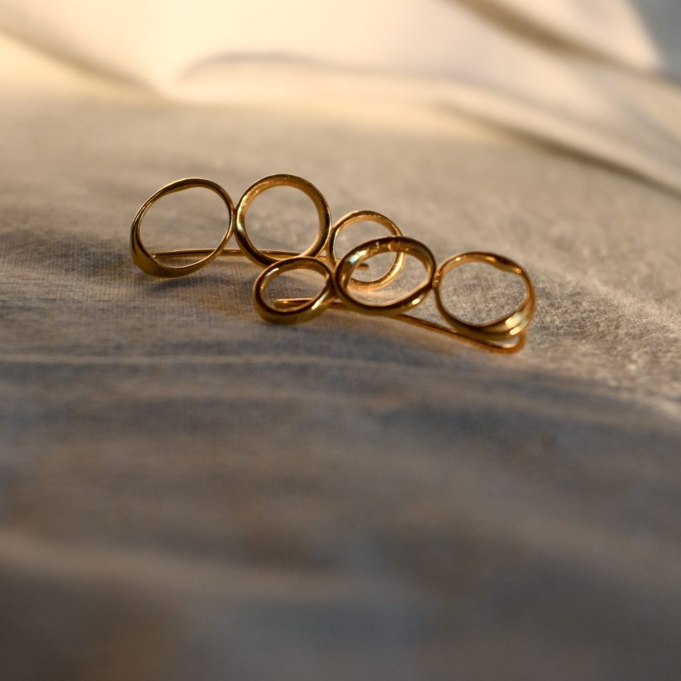 Handmade gold triple circle ear climbers for women, casual and stylish earrings climbing the ear.