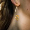 gold plated earrings with freshwater pearls and hanging hearts, hearts charms earrings, charms in heart shape, long earrings, handmade gold designs, handmade gold creations.
