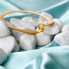 handmade gold plated brass bracelet with seashell, handmade greek gold plated brass bracelet with seashell, handmade summer gold plated brass bracelet with seashell, handmade bracelet for greek summer, handmade gold plated brass creation with seashell for summer.