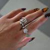 KIRKI Embrace Silver Steel Ring in stainless steel with silver plated finish. A contemporary jewelry piece with elegant curves that gracefully hug your fingers.