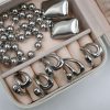 KIRKI Embrace Silver Steel Ring in stainless steel with silver plated finish. A contemporary jewelry piece with elegant curves that gracefully hug your fingers.