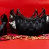 How elegant, how classy, how you? The Black Capitone Halfmoon Bag identifies with the female curves, the warm aura of the female body and becomes like us. christina malle brand bags
