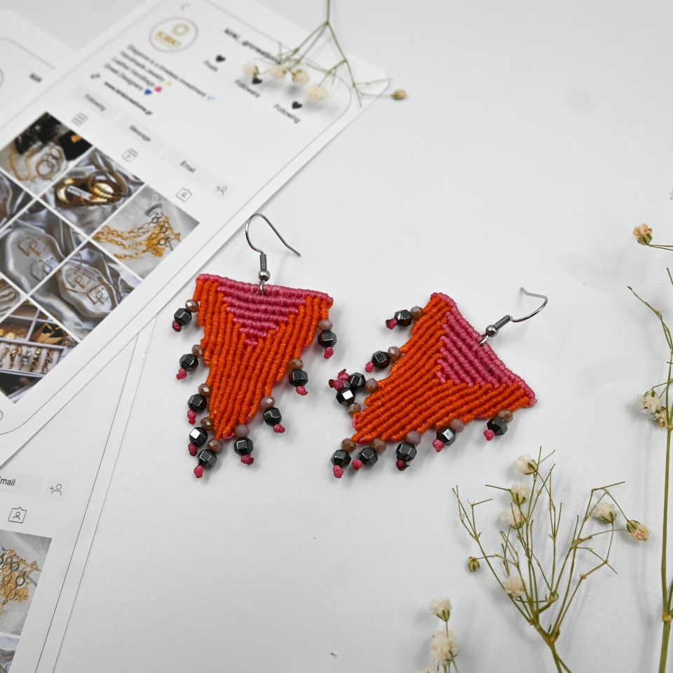 Boho-chic greek-inspired pink macrame earrings featuring a geometric pattern and semi-precious hematite stones, perfect for spring and summer season.