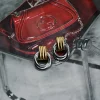 The Eterna Duo Earrings are a must-have silver and gold jewelry piece, going viral on TikTok and Instagram. Made from durable stainless steel, these earrings add a modern touch to any outfit.