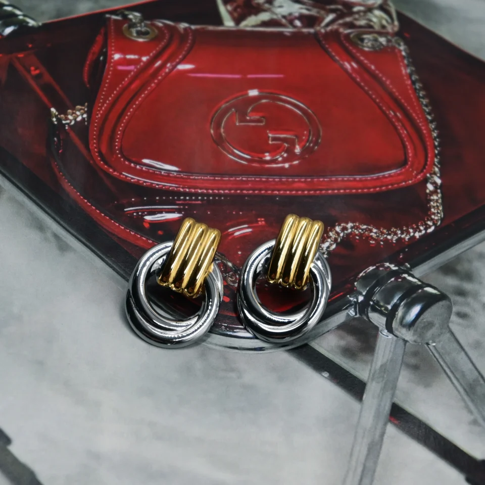The Eterna Duo Earrings are a must-have silver and gold jewelry piece, going viral on TikTok and Instagram. Made from durable stainless steel, these earrings add a modern touch to any outfit.