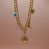 Soleil Gold Steel Charm Necklace with 18K gold-plated steel chain and hanging charms including steel heart, moon, peephole and a zircon. Water-resistant must-have summer jewelry for women.