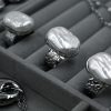 square baroque pearl ring made of durable stainless steel with silver plating and a lustrous baroque pearl. features a hammered base with the possibility of adjustment