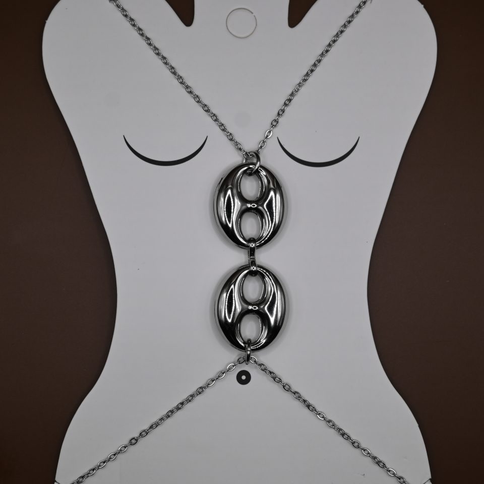 The Seraphine Harness Body Chain in stainless steel with silver plating, features bold interlocking links — the ultimate statement piece of strength and sensuality.