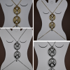 The Seraphine Harness Body Chain in stainless steel, available in silver or gold plating, features bold interlocking links — the ultimate statement piece of strength and sensuality.