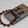 Heart Tartaruga Resin Necklace featuring chunky heart-shaped resin stones in tortoiseshell tones and a gold-plated steel chain — a bold, trendy statement necklace for women.