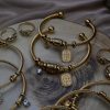 Gold plated stainless steel bracelet with Constantinato charm, evil eye charm, and sparkling zircon charm