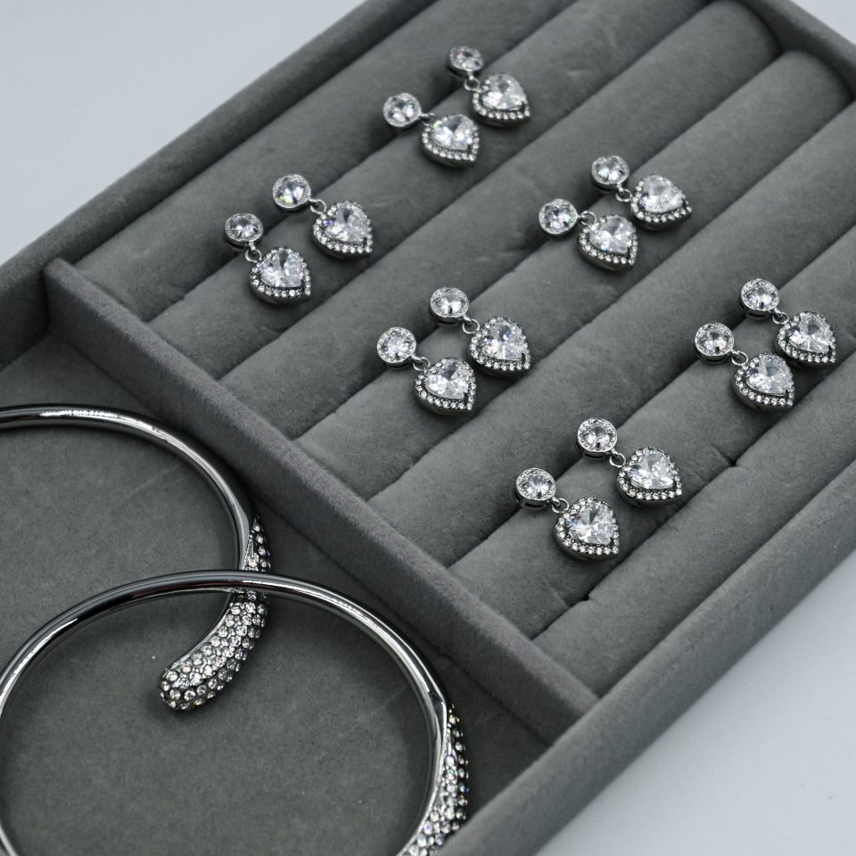 Festive Heart Crystal Earrings made of stainless steel with silver plating. Silver Swarovski-inspired earrings with heart-shaped zircon and rhinestone halo.