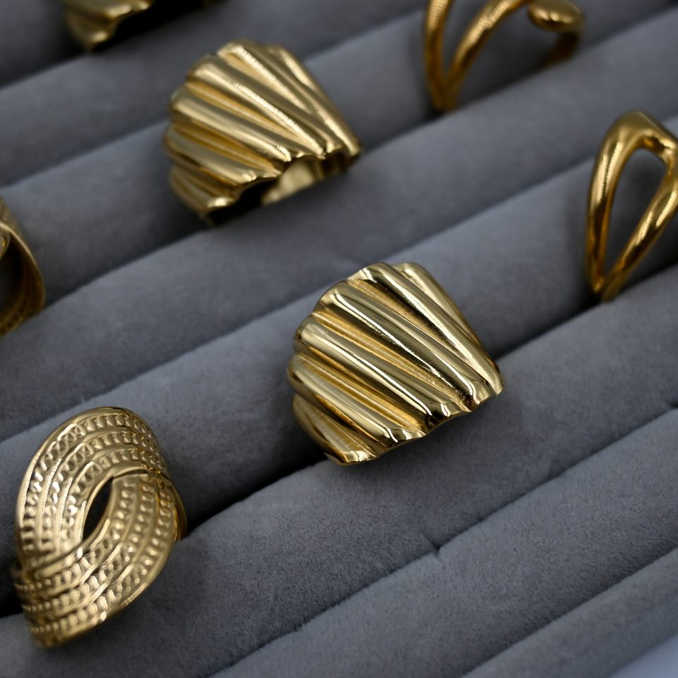 Radiant and sculptural, the Lume Vintage Gold Ring features a polished gold-plated embossed design with an adjustable band. A luxurious timeless design for women.