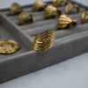 Gold-plated adjustable ring with vintage sculptural embossed design.