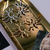 Helia Gold Sunray Earrings made of stainless steel with 18K gold plating and half sun design