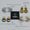 Sun-inspired gold earrings close-up