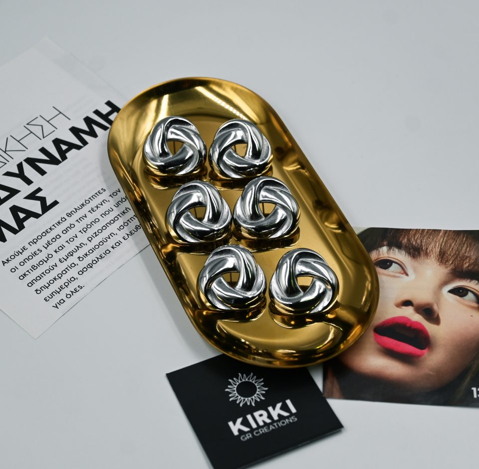 Helix silver steel earrings made of stainless steel with a sculptural helix-inspired design and mirror finish. Dynamic, refined, and timeless.