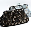 Handmade raffia clutch bag with a black lace exterior lining and a detachable silver metal chain. This raffia clutch bag combines vintage charm with modern versatility. Perfect for everyday elegance or formal occasions, such as a christening or a wedding.