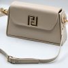 Elegant Raffaello beige shoulder bag, made in Italy from high-quality leatherette. It features a detachable leather strap in the same beige shade as the bag and adjustable length. It is adorned with gold-tone metal details and a magnetic clasp.