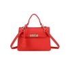 Mini red top-handle bag, made of synthetic leather in Italy. Inspired by Hermès’ Mini Kelly Bags, it features the signature metal clasp. It comes with a detachable and adjustable strap in a shade of red.
