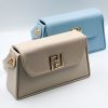 Elegant Raffaello beige shoulder bag, made in Italy from high-quality leatherette. It features a detachable leather strap in the same beige shade as the bag and adjustable length. It is adorned with gold-tone metal details and a magnetic clasp.