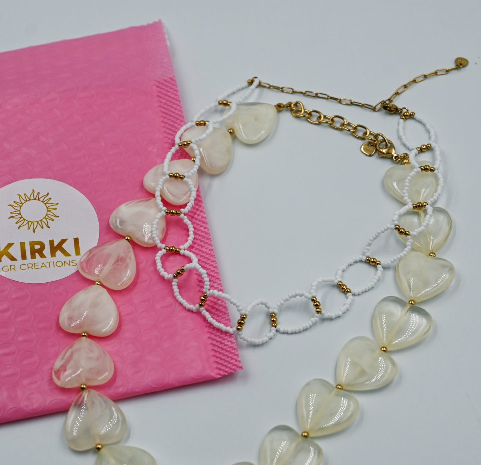 Solara beaded choker necklace with white beads and gold-tone steel details. A playful, saltwater-resistant summer essential for women and teen girls.