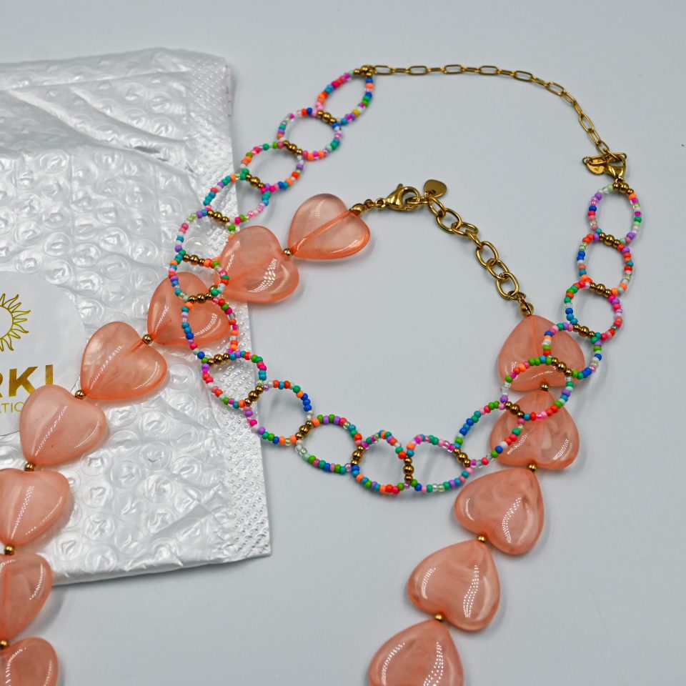 Colorful beaded choker necklace with vibrant colored beads and gold-tone steel details. A playful, saltwater-resistant summer essential for women and teen girls.