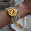 Gold coin beaded bracelet made of 18-karat gold-plated stainless steel, with silk thread and white beads. A boho-chic summer bracelet with personality and a unique character.