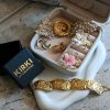 Statement gold ring with floral resin centerpiece