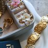Gold flower statement ring with white resin flower