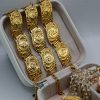 Helios coin statement bracelet with intricate design. Bold, iconic, and perfect for adding a unique and powerful touch to any look.