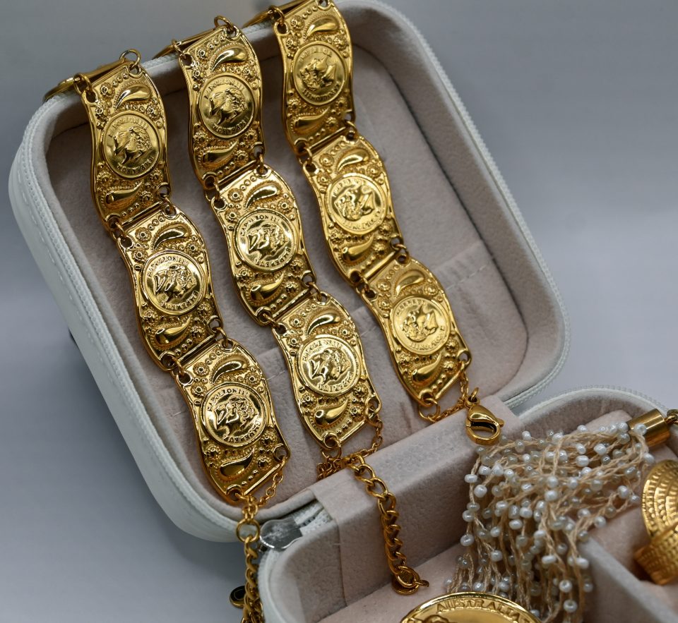 Helios coin statement bracelet with intricate design. Bold, iconic, and perfect for adding a unique and powerful touch to any look.