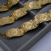 Helios coin statement bracelet with intricate design. Bold, iconic, and perfect for adding a unique and powerful touch to any look.