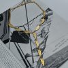 Stunning Angel Wings Gold Tie Necklace crafted from durable stainless steel with an 18-karat gold plating and engraved angel wing elements. Perfect for the summer months, it highlights the neckline and draws all eyes.