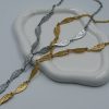 Stunning Angel Wings Gold Tie Necklace crafted from durable stainless steel with an 18-karat gold plating and engraved angel wing elements. Perfect for the summer months, it highlights the neckline and draws all eyes.