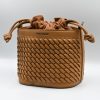 Sienna Sand Bucket Bag made in Italy from woven-effect synthetic leather with detachable top handle, adjustable crossbody strap, soft drawstring closure, matching interior lining, and interior zip pocket.