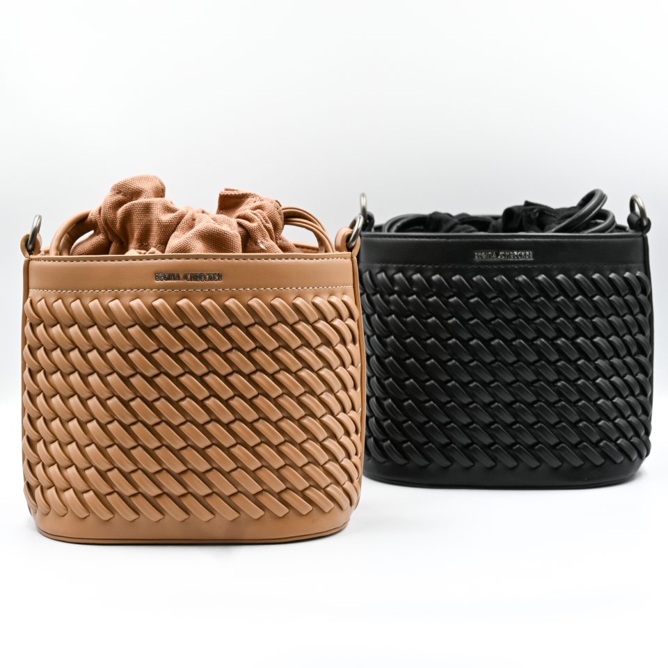 Sienna Sand Bucket Bag made in Italy from woven-effect synthetic leather with detachable top handle, adjustable crossbody strap, soft drawstring closure, matching interior lining, and interior zip pocket.