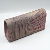 Kallisti Sparkling Pink Clutch Bag made of shimmering pink fabric with elegant front design, detachable silver chain, magnetic closure, pink lining, and interior pocket.